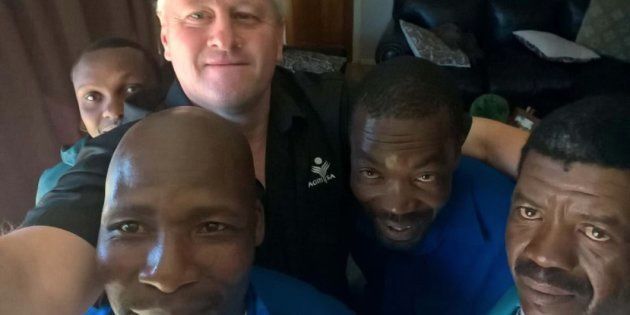 Agri SA president Dan Kriek (back, centre) with his farmworkers after a prayer meeting on Monday. From left to right: Ace Mokoena, Piet Mokoena, Kriek, Abrahm Ndaba and Alfred Tsotetsi