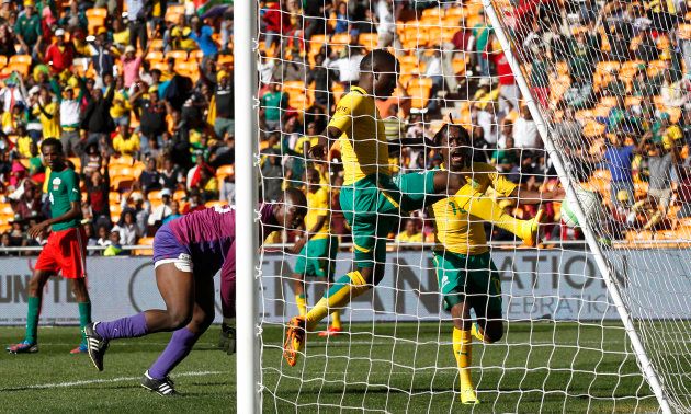 South Africa's Luyolo Nomandela (C) scores against Burkina Faso during the inaugural Nelson Mandela Sport and Culture Day at the soccer city stadium in Soweto, August 17, 2013. REUTERS/Siphiwe Sibeko