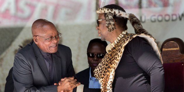 President Jacob Zuma (L) greets Zulu King Goodwill Zwelithini at the Moses Mabhida Football stadium to celebrate South Africa's Heritage Day in Durban on September 24, 2016.