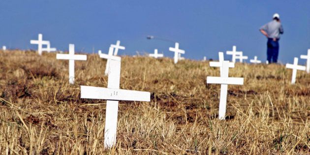 1,500 white crosses have been planted next to the John Vorster off-ramp near the N1 in Centurion as evidence and as a protest for the 1,500 people who have died due to farm attacks, shown here on July 27, 2003, in Pretoria, South Africa.