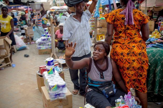 Traders sell their wares at Makola market in Accra, Ghana, June 15, 2015.