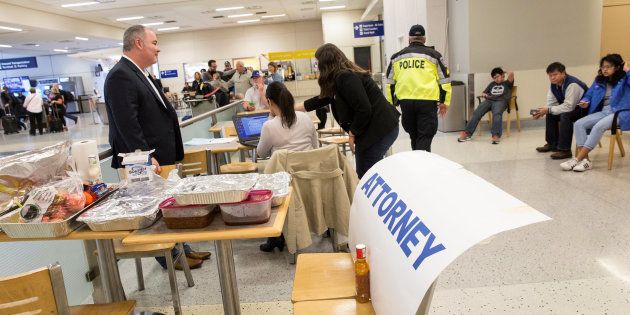 Attorneys volunteer their services at Dallas/Fort Worth International Airport after a federal judge in Washington state issued a nationwide stop of the travel ban imposed by U.S. President Donald Trump's executive order in Dallas, Texas.