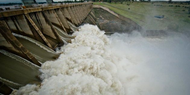 The Vaal Dam south of Johannesburg three years ago in March 2014, where rising water was a problem and sluice gates were open. Now the dam is only 63% full.