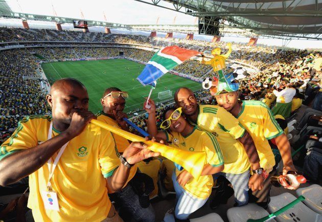 South African fans celebrate during the International Friendly match between South Africa and Thailand from Mbombela Stadium on May 16, 2010 in Nelspruit, South Africa. (Photo by Lefty Shivambu/Gallo Images/Getty Images)