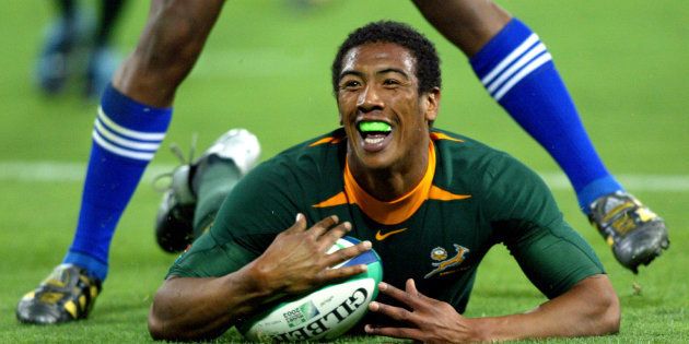 Ashwin Willemse celebrates as he scores during a 2003Rugby World Cup Pool C match against Samoa at Lang Park in Brisbane,November 1, 2003.