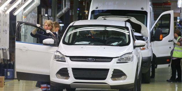 A female worker does a quality control inspection of a Ford Kuga at the Ford Sollers production plant in Elabuga, Russia, on Thursday, September 3, 2015.