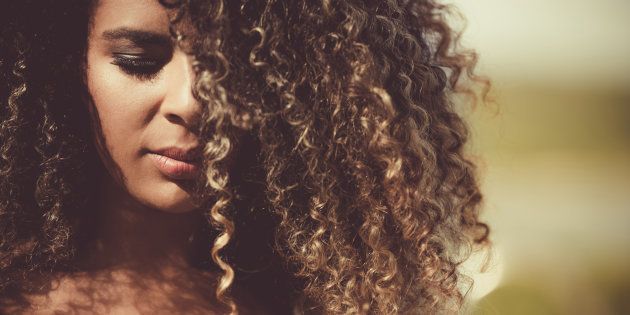 Beautiful woman / Close up portrait of a beautiful female fashion model with curly hair