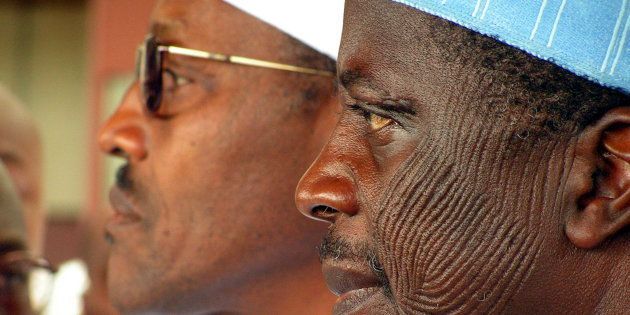 Nigerian President Muhammadu Buhari (left) with Alhaji Bafarawa (with traditional markings on his face).