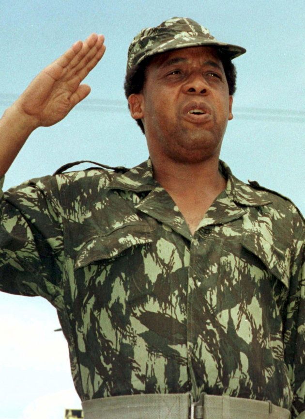 South African Communist Party leader Chris Hani salutes at a rally of the African National Congress (ANC) in this file picture taken December 16, 1991. REUTERS/Mike Hutchings/Files