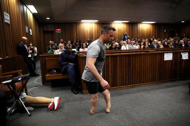 Paralympic gold medalist Oscar Pistorius walks across the courtroom without his prosthetic legs during the third day of the resentencing hearing for the 2013 murder of his girlfriend Reeva Steenkamp, at Pretoria High Court, South Africa June 15, 2016.