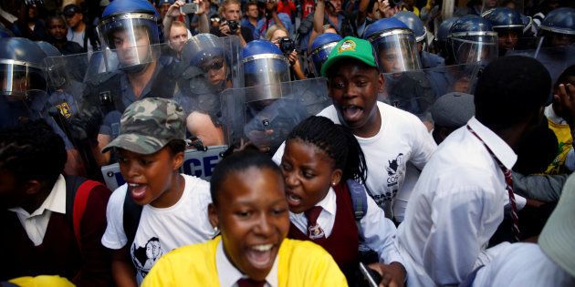 Supporters of the African National Congress (ANC) are confronted by police ahead of President Jacob Zuma's State of the Nation Address (SONA) to a joint sitting of the National Assembly and the National Council of Provinces in Cape Town, South Africa February 9, 2017.