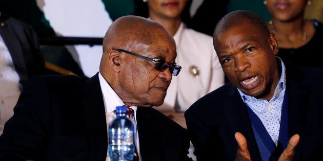 South Africa's President Jacob Zuma chats with Premier of North West Province Supra Mahumapelo before addressing the National Youth Day commemoration, under the theme