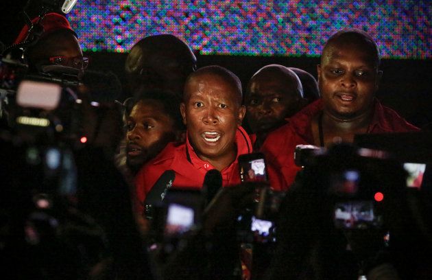 Leader of the Economic Freedom Fighters (EFF) Julius Malema speaks to the media after being removed by security officials from President Jacob Zuma's State of the Nation Address.