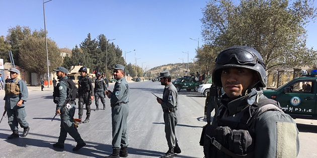Afghan security personnel gather at the site of an ongoing attack on a television station in Kabul on November 7, 2017.