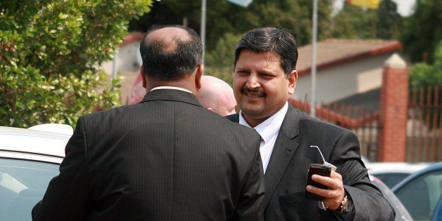 Atul Gupta (R) attends Randburg Magistrate's court on September 27, 2010 in Johannesburg.