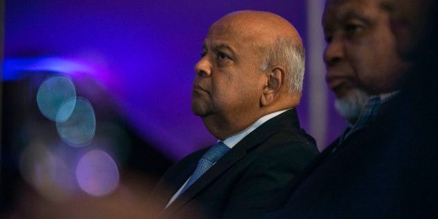 Former finance minister Pravin Gordhan (L) and former president Kgalema Mothlante (R) attend the opening night of the documentary film Promises and Lies screening at the Constitutional Hill on May 4, 2017 in Johannesburg.