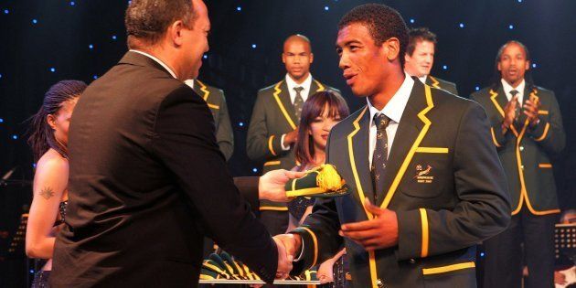 Oregan Hoskins hands Ashwin Willemse his cap for the 2007 Rugby World Cup. September 2 2007, in Sandton.