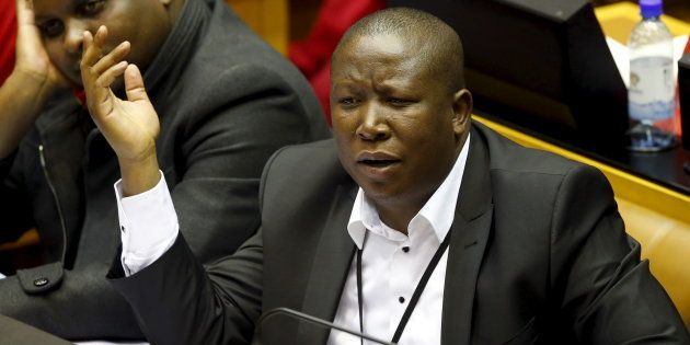 Opposition Economic Freedom Fighters leader Julius Malema reacts as South Africa's President Jacob Zuma answers questions in parliament in Cape Town August 6, 2015.