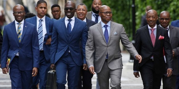 Finance Minister Malusi Gigaba is flanked on his right by treasury director-general Dondo Mogajane and on his left by his deputy Sfiso Buthelezi and SARS commissioner Tom Moyane during Gigabas Medium-term budget speech in Parliament on October 25, 2017 in Cape Town, South Africa.