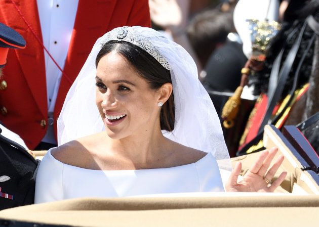 Meghan, Duchess of Sussex leaves Windsor Castle in the Ascot Landau carriage during a procession after getting married at St George's Chapel on May 19 in Windsor, England.