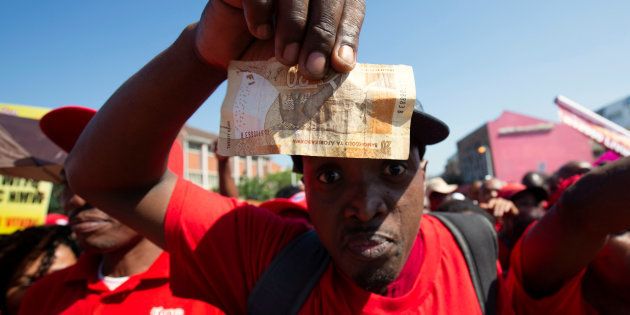 Union members protest the proposed national minimum wage during a march in Durban, South Africa, April 25, 2018.