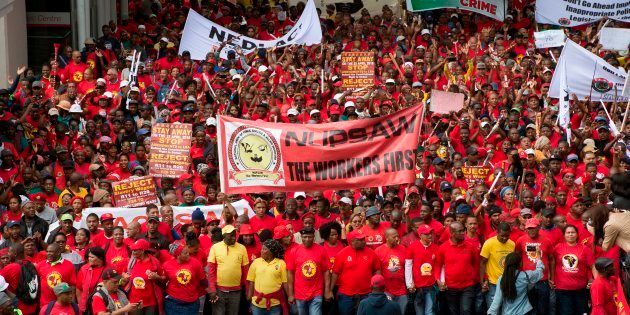 Around 1,500 members and supporters of the South African Federation of Trade Unions (Saftu) march through the city centre of Cape Town on April 25 2018 to protest against government's proposed minimum wage during a countrywide national strike.