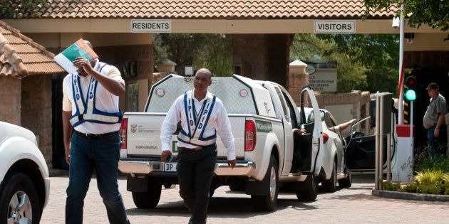 Members of the Independent Police Investigative Directorate (IPID) raid the home of South African Police Service Acting National Commissioner, Lieutenant General Khomotso Phahlane, as part of a corruption investigation on January 19, 2017 in Johannesburg. Phahlane is accused of taking kickbacks to secure tenders for a company during his tenure as head of the police forensics division.