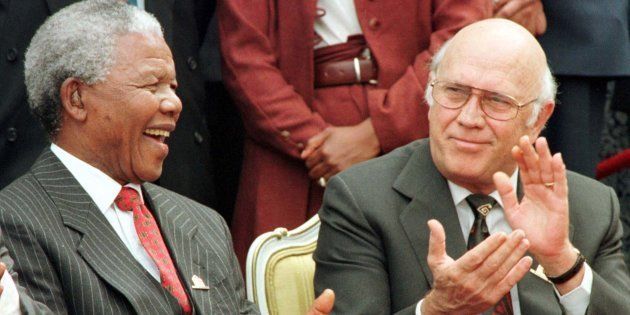 President Nelson Mandela and Deputy President FW. de Klerk share a joke outside Parliament after the approval of South Africa's new constitution.