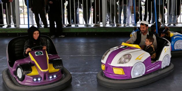 Afghans ride on bumper cars at City Park, the first amusement park in Kabul November 28, 2014. REUTERS/Mohammad Ismail (AFGHANISTAN - Tags: SOCIETY)