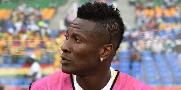 Ghana's forward Asamoah Gyan who is recovering from an injury sits on the bench during the 2017 Africa Cup of Nations quarter-final football match between DR Congo and Ghana in Oyem on January 29, 2017.