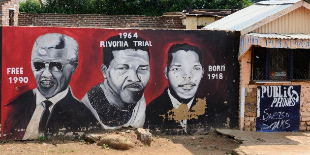 Mural painting illustrating anti-apartheid activist and former president of South Africa Nelson Mandela in the township of Orlando, Soweto.