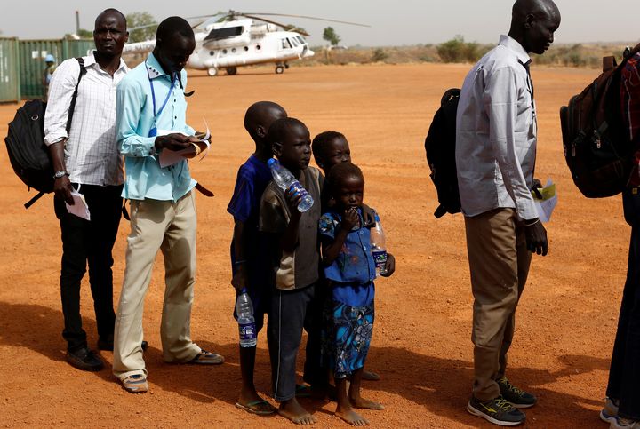 Machiey Mario, 8, Ruai Mario, 10, Nyameer Mario, 6 and Nyawan Mario, 4 (L-R), wait to board a United Nations flight to Juba where they will be reunited with their mother, near Bentiu, South Sudan, February 13, 2017. REUTERS/Siegfried Modola