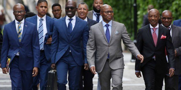 Finance Minister Malusi Gigaba is flanked on his right by Treasury director-general Dondo Mogajane, and on his left by his deputy Sfiso Buthelezi and SARS commissioner Tom Moyane before Gigaba's medium-term budget speech in Parliament on October 25, 2017 in Cape Town, South Africa.