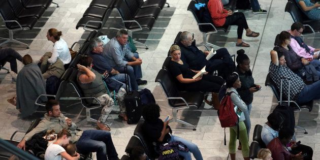 Passengers wait for their flights at the Cape Town International Airport in Cape Town, South Africa, January 12, 2018.