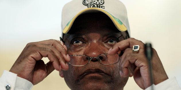 Can he see more clearly now? Jacob Zuma puts on his reading glasses.