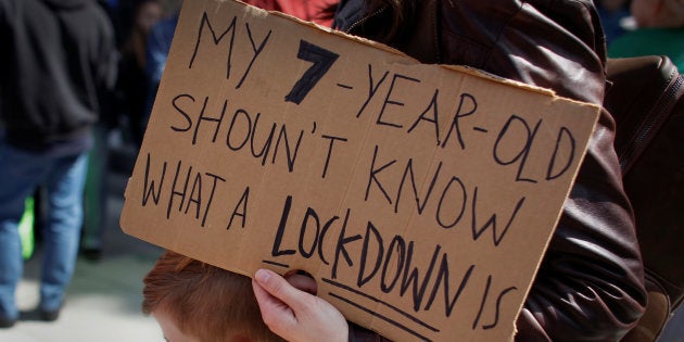 A protester holds a sign during a 'March For Our Lives' demonstration demanding gun control in Sacramento, California, U.S. March 24, 2018.