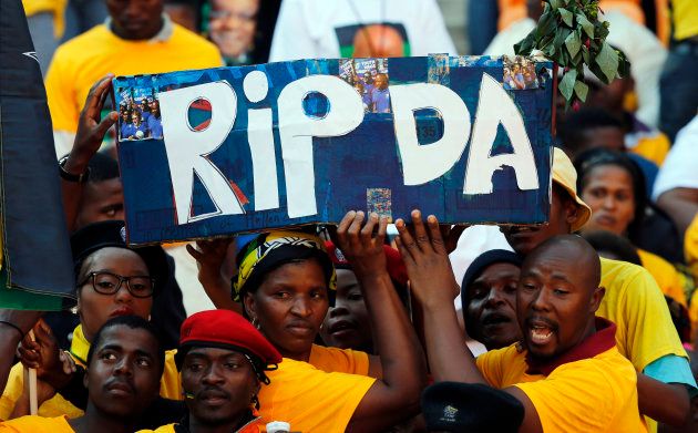 ANC supporters hold a mock coffin during their party's final election rally in Soweto, May 4, 2014.