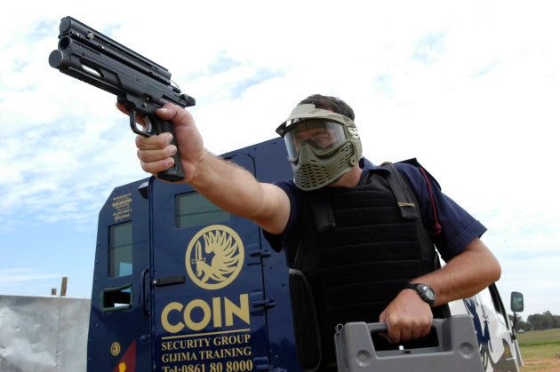 Training instructors from COIN Security Company simulate a cash in transit heist at a training ground in Centurion. December 15, 2005.