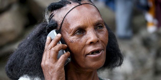 A woman makes a call on her mobile phone in Ethiopia's capital, Addis Ababa, November 9, 2015.