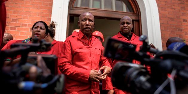 EFF leader Julius Malema (C) talks to the press after staging a walk out during the election by the Members of Parliament of the new South African President on February 15, 2018 in Cape Town.