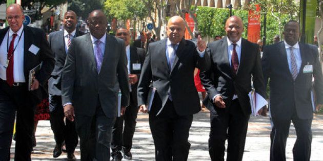 South Africa’s Minister of Finance Pravin Gordhan flanked by his deputy Mcebisi Jonas and Director-General Lungisa Fuzile.