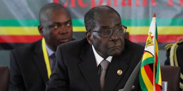 Zimbabwe's President Robert Mugabe listens to speakers at the 34th Southern African Development Conference (SADC) summit in Victoria Falls August 17, 2014.