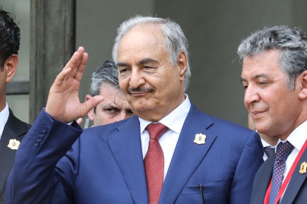 Libya Chief of Staff, Marshall Khalifa Haftar, whose rival Libyan National Army dominates the country's east, gestures as he stands on the steps of the Elysee Palace following the International conference on Libya on May 29 2018, in Paris. Four Libyan leaders committed to holding elections in the fractured country on December 10 in a joint statement issued at a peace conference in Paris.