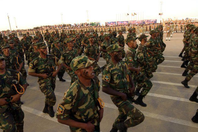 Soldiers from the self-styled army of Libyan strongman Khalifa Haftar take part in a military parade in the eastern city of Benghazi on May 7 2018, during which Haftar announced a military offensive to take from 'terrorists' the city of Derna, the only part of eastern Libya outside his forces' control.