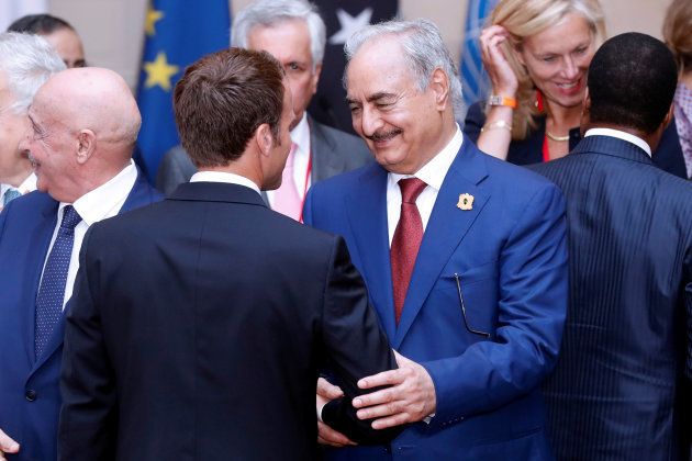 Khalifa Haftar, the military commander who dominates eastern Libya, shakes hands with French president Emmanuel Macron after the participants of the International Conference on Libya listened to a verbal agreement between the various parties regarding the organization of a democratic election this year at the Elysee Palace in Paris, France, May 29 2018.