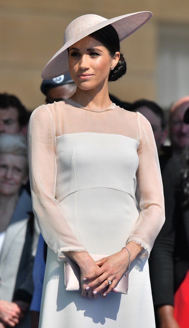 The Duchess of Sussex attends her father-in-law the Prince of Wales' 70th Birthday Garden Party at Buckingham Palace on May 22.