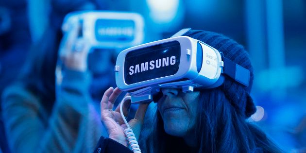 A visitor plays a game with the virtual reality head-mounted Samsung Gear VR powered by Oculus at 'Le Grand Palais' on December 15, 2016 in Paris, France.