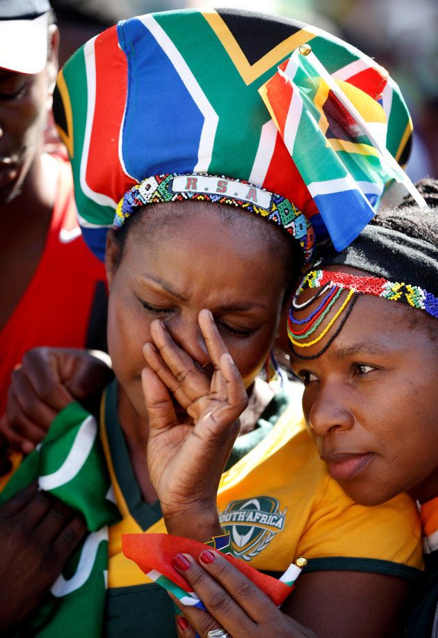 South African fans react after France was announced as the Rugby World Cup host country for the Rugby World Cup in 2023, at a public viewing area.