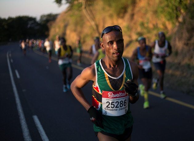 Runners competing in the Comrades Marathon pass through Kloof; June 4 2017. REUTERS/Rogan Ward