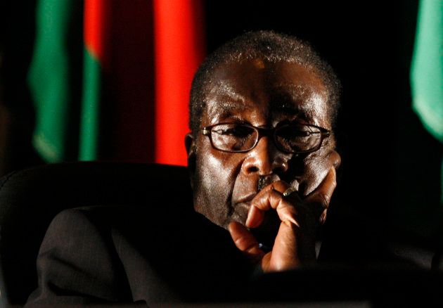 Zimbabwean President Robert Mugabe watches a video presentation during the summit of the Southern African Development Community (SADC) in Johannesburg August 17, 2008.